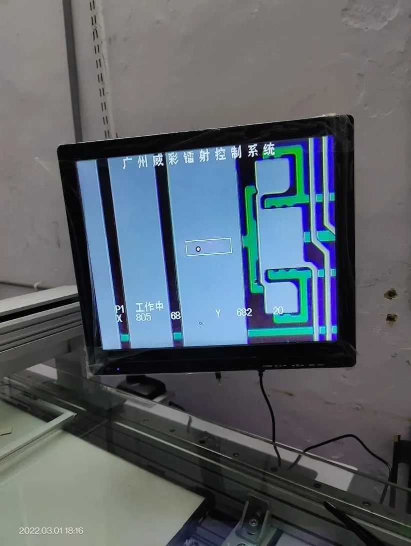 Television displaying a test pattern on a workbench