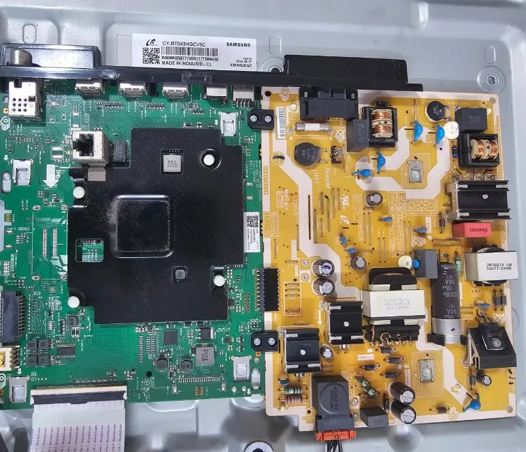 Main board and power board shown inside an open television