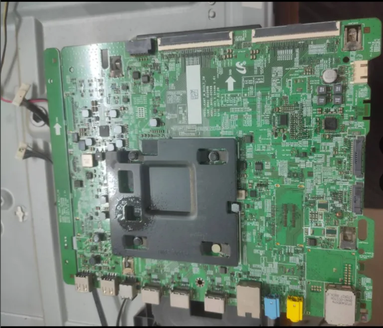 Close view of a television main board and its connections