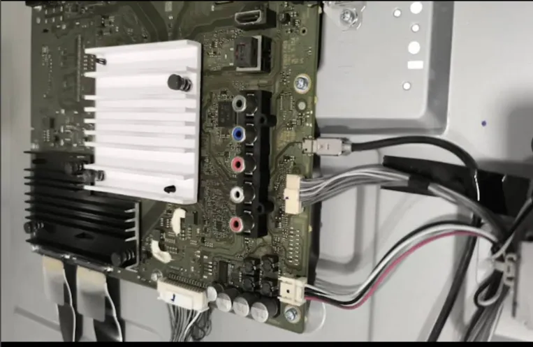 Television circuit board with a heat sink and connected cables